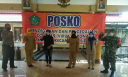 “Babinsa Koramil 0816/01 Sidoarjo siaga Posko Covid -19”