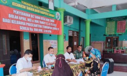 Babinsa Penatarsewu Melaksanakan Giat Pendampingan Penyaluran BLT- DD